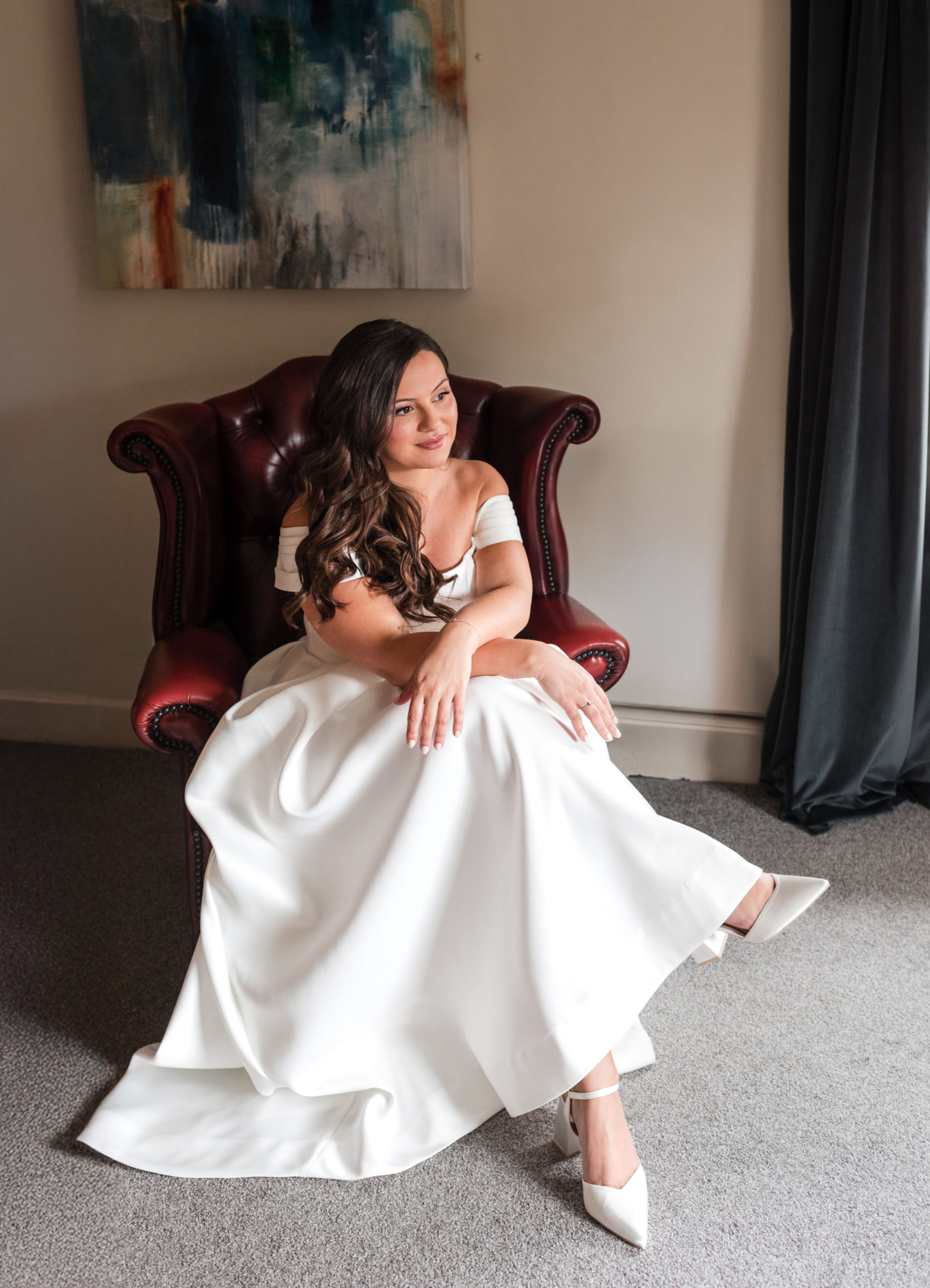 editorial wedding photography at St Johns House Lichfield - Bride sitting in an armchair