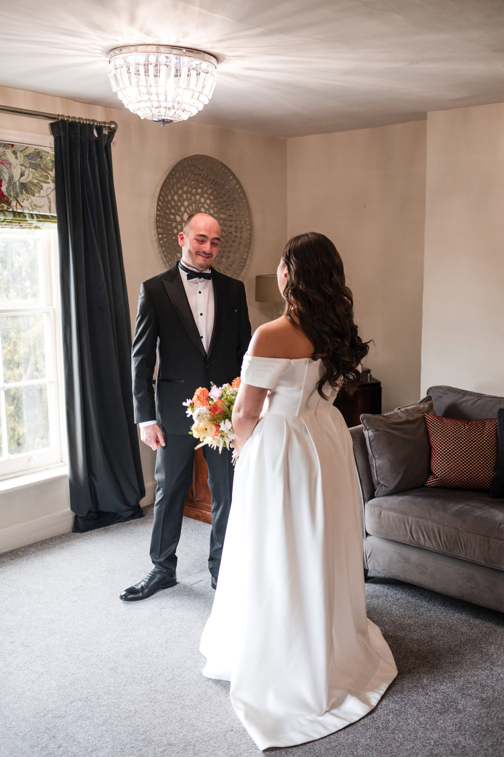 Groom seeing his Bride for the first time before their wedding ceremony in Lichfield